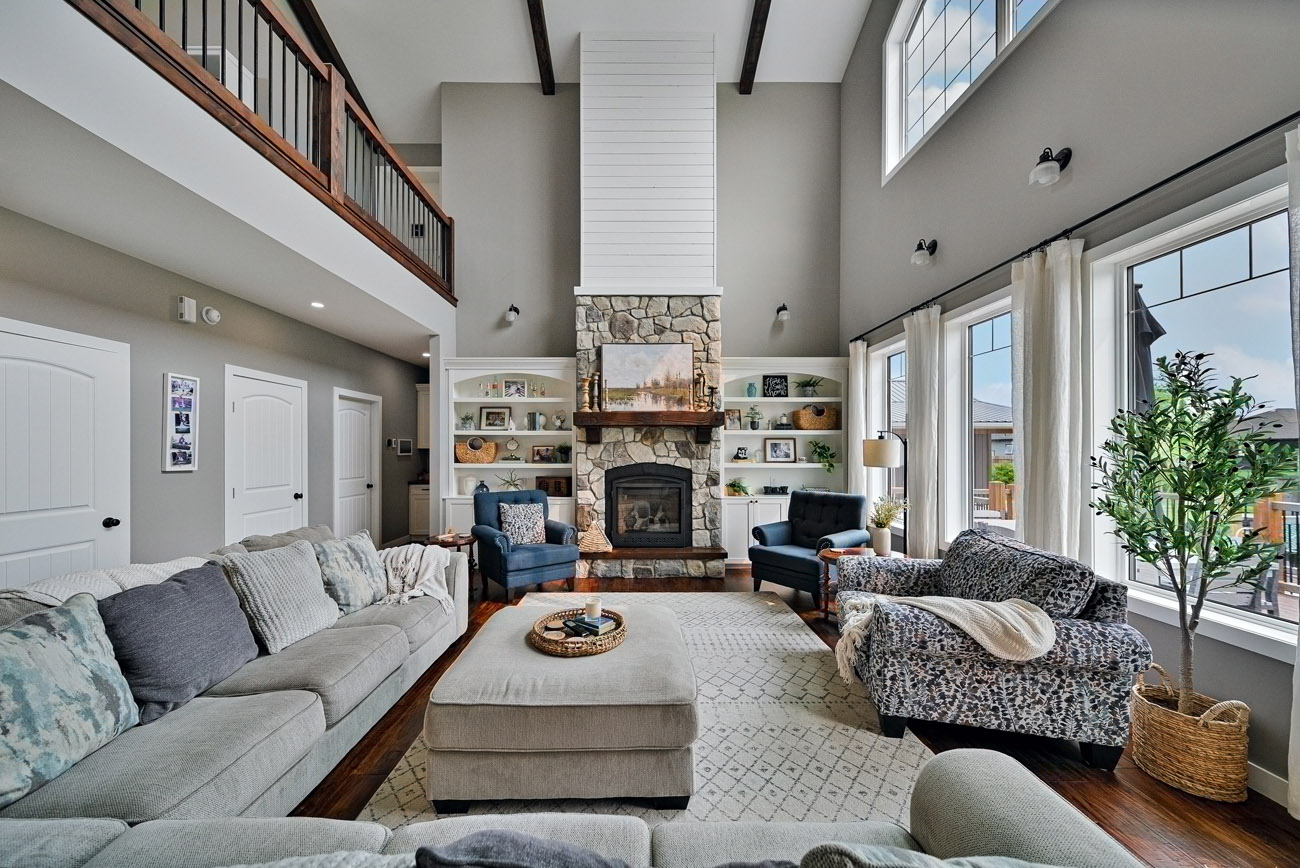 large high ceiling living area with fireplace