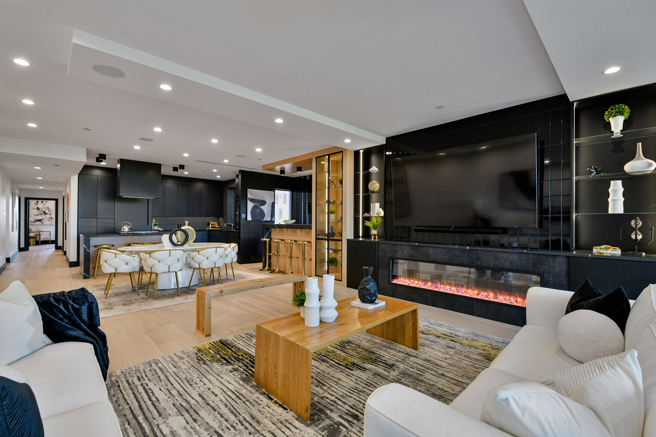 large open concept living area with black kitchen