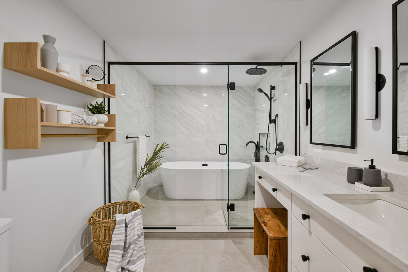 designer bathroom with tub in shower