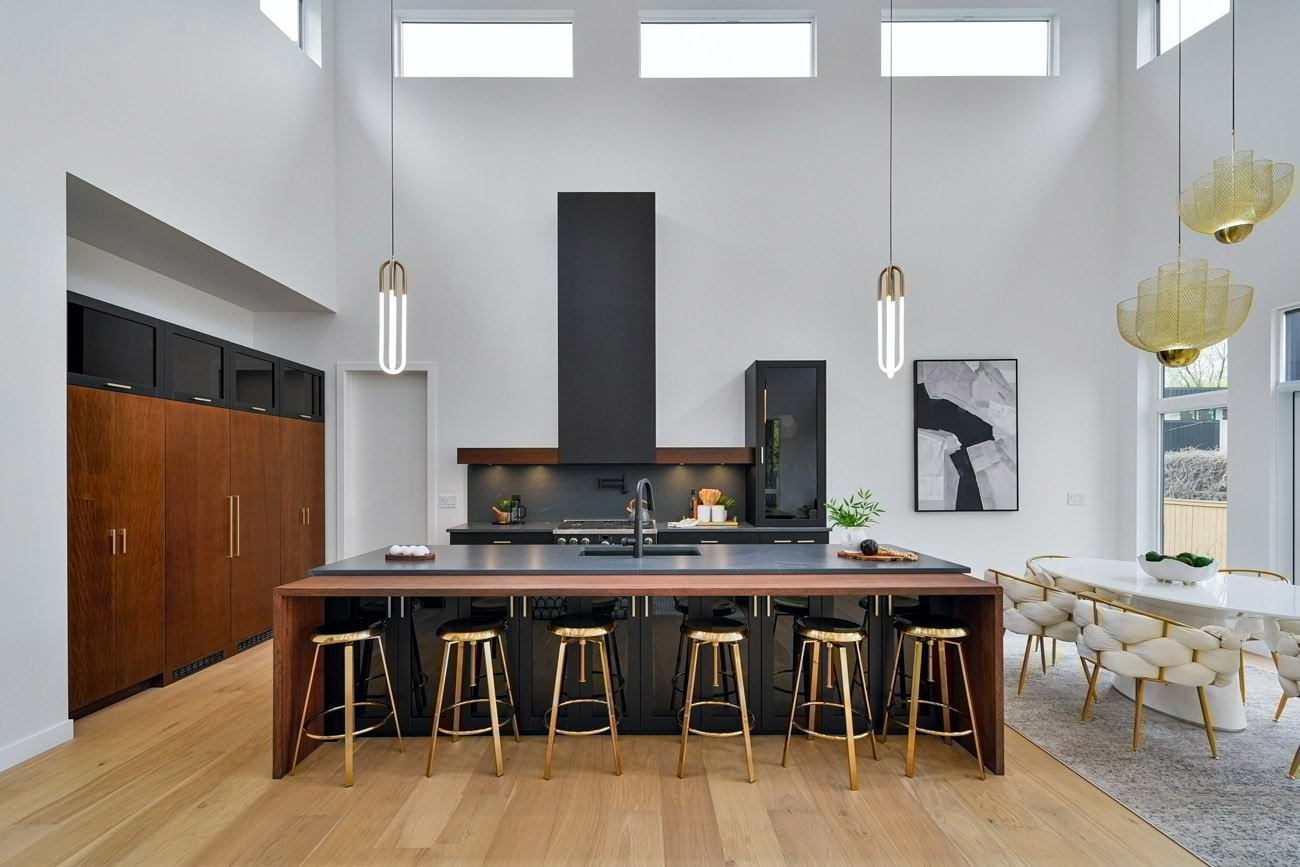 Showhome kitchen black counters high ceilings