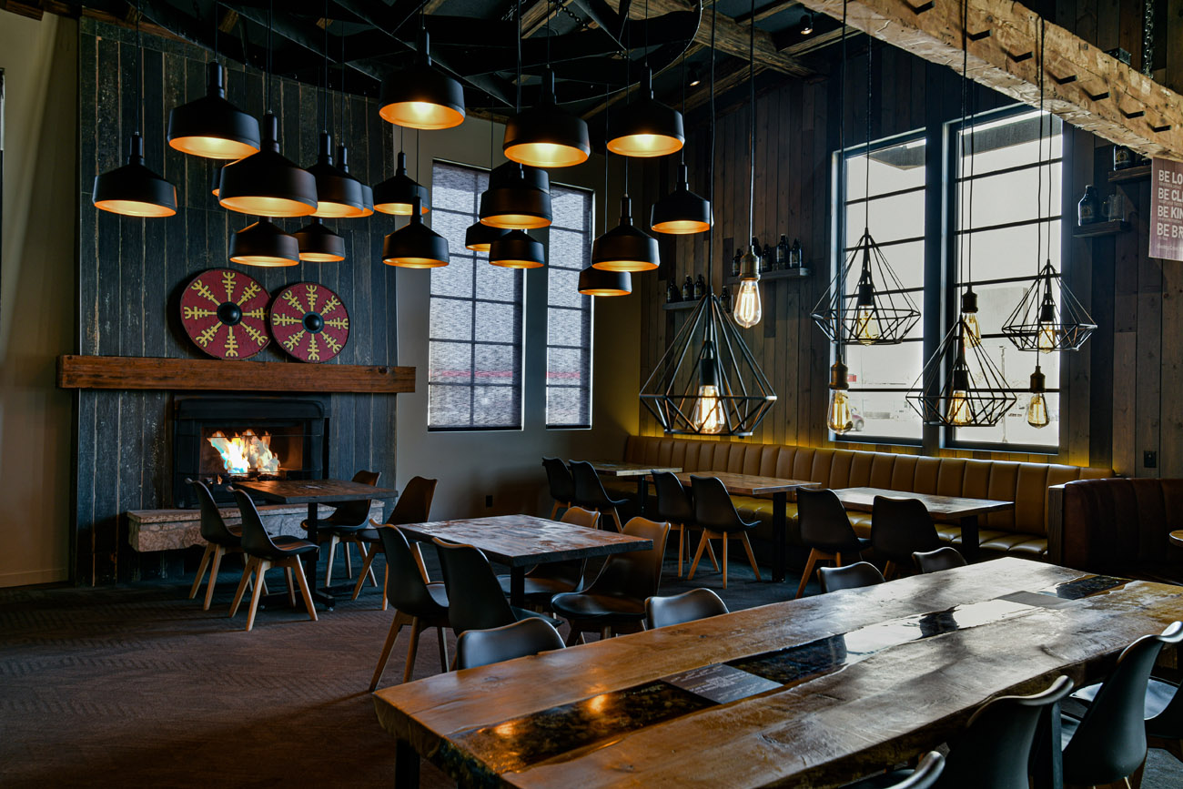 Brazen hall Dimly lit restaurant and bar with fireplace