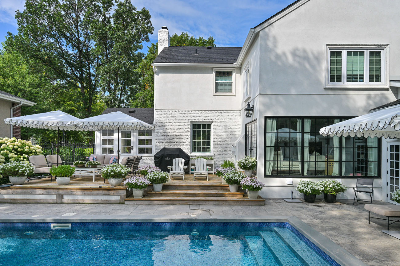 back yard pool with umbrellas open