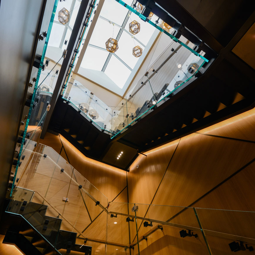 dimly lit stairway with skylight