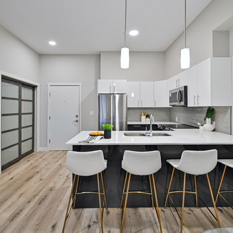 white kitchen with barstools