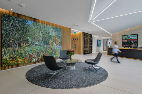 woman walking through lobby at TDS Law